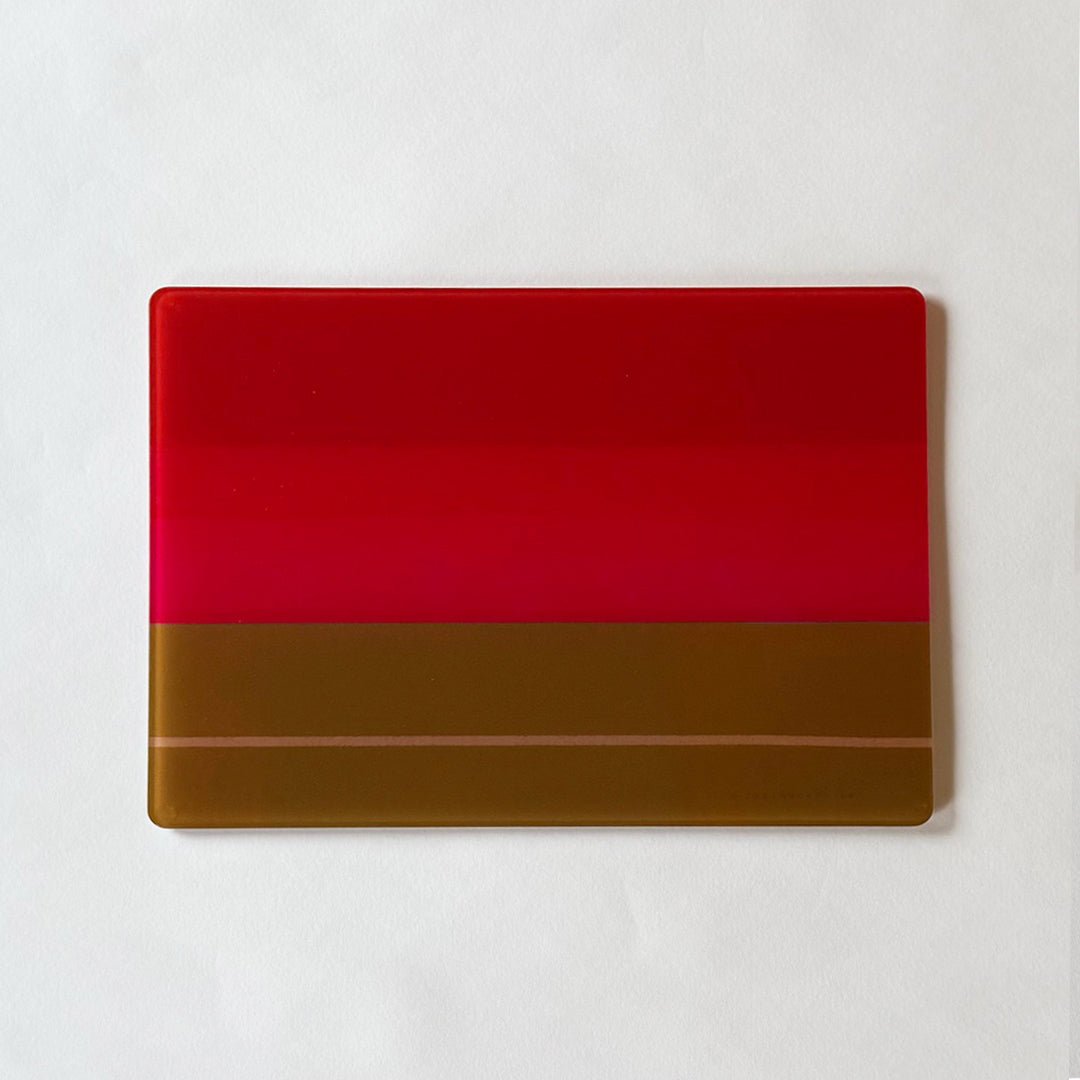 Recycled glass platter in striking abstract design shades of olive green, red and pink