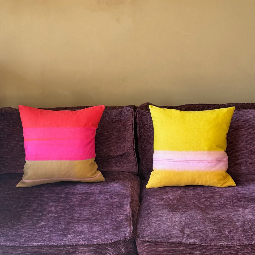 cushion - COLOURBLOCK PIMENTO and COLOURBLOCK OCHRE colourful cushions on plum sofa