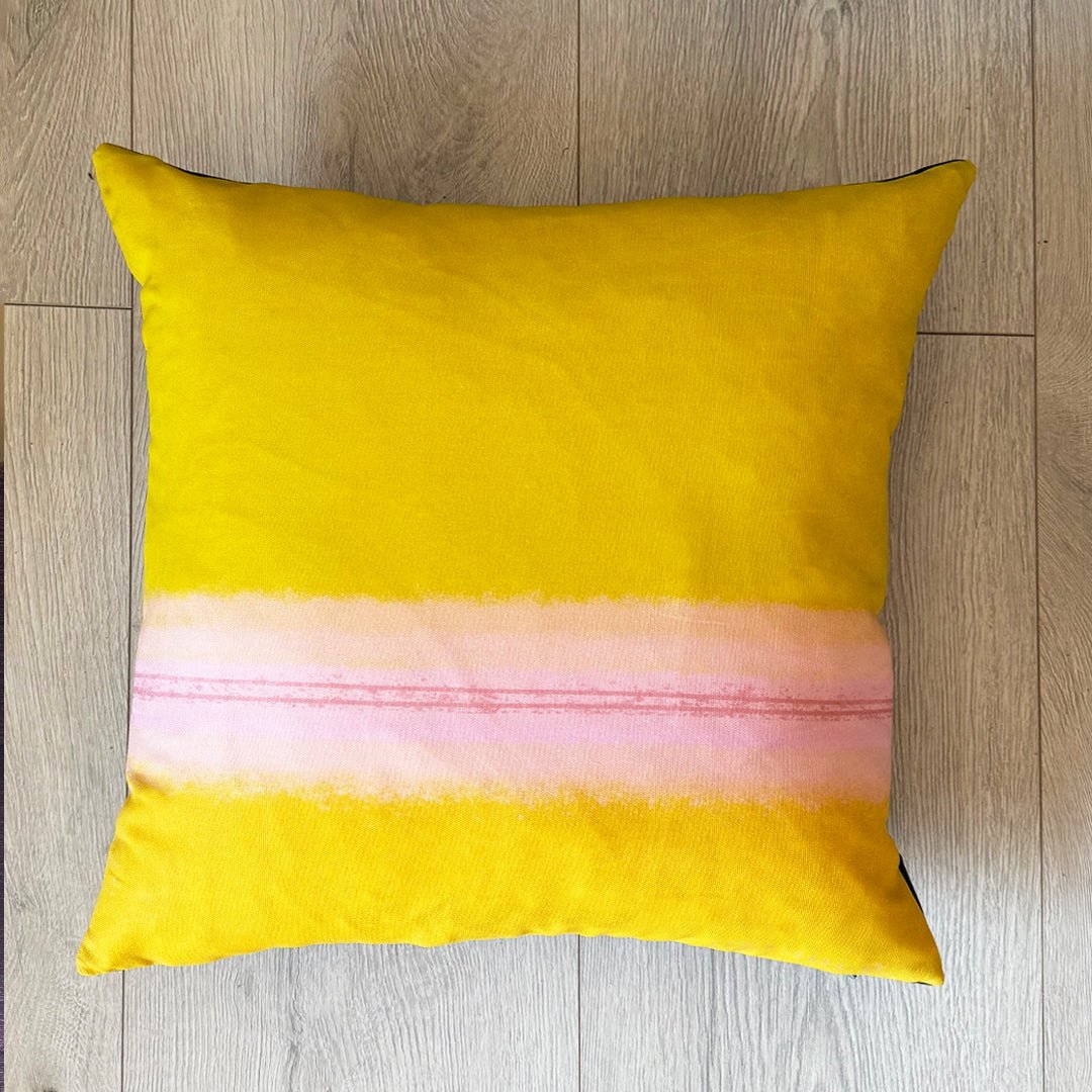 COLOURBLOCK OCHRE cushion on a wooden floor